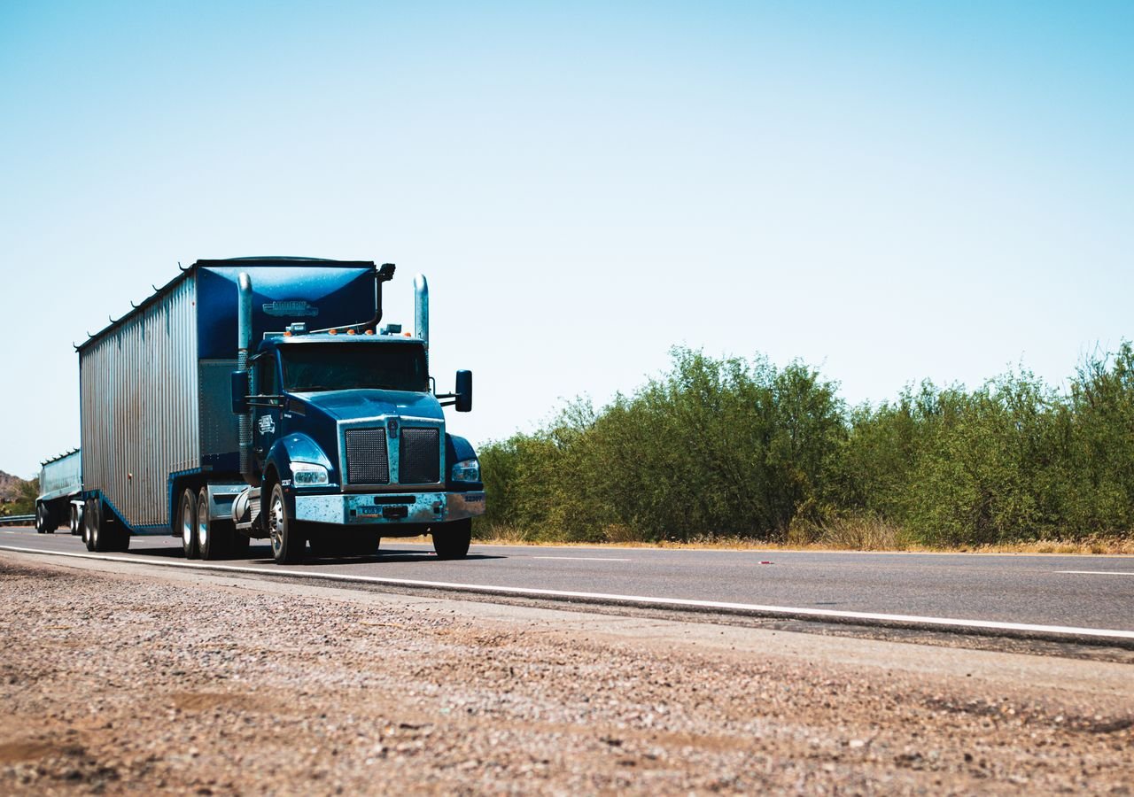 Blue day-cab dry van semi-truck